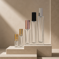 Meilleur prix de gros pour flacon de parfum en verre cylindrique haut avec pompe pulvérisatrice métallique pour les marques de cosmétiques et de soins personnels