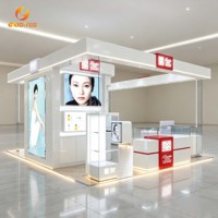 Vitrine de présentation de cosmétiques de luxe avec étagères en verre et éclairage LED pour les boutiques de beauté