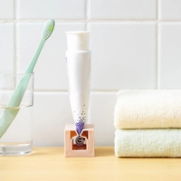 TX vente en gros ménage Portable dentifrice Tube roulant presse-agrumes salle de bain distributeur de dentifrice