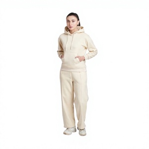 Ensemble de survêtement 2 pièces en coton pour femme avec logo personnalisé, comprenant un sweat à capuche et un pantalon de jogging en maille gaufrée, idéal pour la détente - Product Image 1