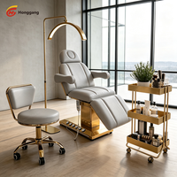 Lit de beauté électrique de luxe à base dorée avec 3 moteurs, table de massage facial réglable pour spa