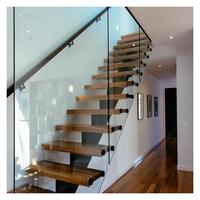 Escalier flottant moderne en bois de chêne massif avec marches en bois et support dissimulé, garde-corps en verre pour villa intérieure