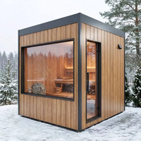 Sauna extérieur moderne en forme de cube, préfabriqué en bois massif, avec grande fenêtre panoramique en verre pour villa, jardin ou spa.