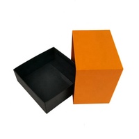Boîte cadeau de parfum personnalisée à blocs de couleur, base et couvercle orange et noir avec insert en éponge pour parfum de luxe