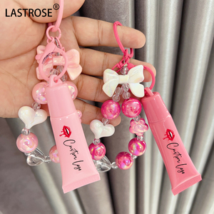 Bonito tubo exprimidor de plástico rosa para brillo de labios Esencia de labios <span class=keywords><strong>Lipoil</strong></span> contenedor vacío con llavero embalaje cosmético para forma líquida - Product Image 2