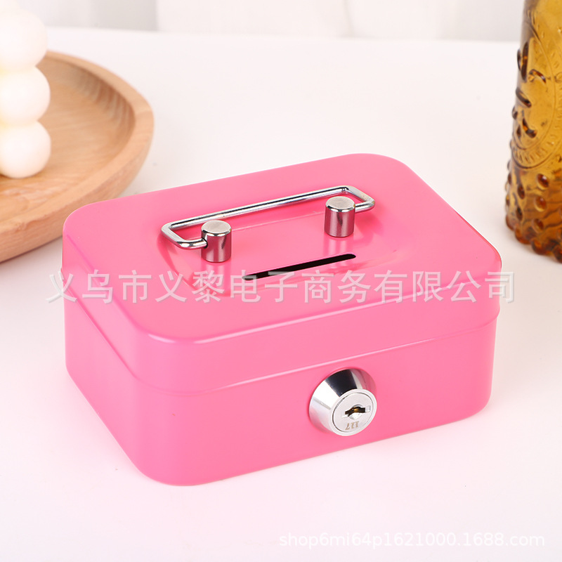 Tirelire rose en forme de clé