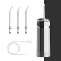Hydropulseur rechargeable pour le nettoyage des dents avec trois buses et sac de voyage