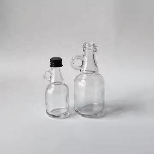 Tarro de jarabe de arce reutilizable transparente de 1,7 oz, botella de jarabe de vidrio para salsa de aceite de leche con tapa de aluminio y mango de bucle - Product Image 1