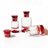 Boîte de parfum ronde au design unique Pot cosmétique en verre Bouteilles de pulvérisation en verre Bouteille d'huile essentielle Bouteille de parfum de 100ml