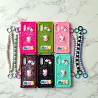 Vente en gros d'étuis de téléphone pour femmes avec quatre coins anti-chute en résine époxy, poupée et bracelet pour Iph 11 12 13 Pro MaX