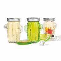 Vente en gros de bouteilles de boisson aux fruits d'orange de 100 ml, bouteille d'eau créative en forme de cactus, bocal en verre avec poignée et couvercle avec paille