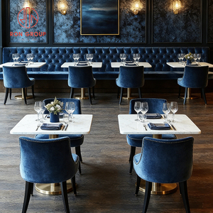 Juego de Muebles de Restaurante Modernos y Lujosos: Sofá de Terciopelo Azul Marino con Botones y Mesa Redonda de Mármol Blanco - Product Image 1