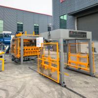 Machine de fabrication de blocs de béton hydraulique entièrement automatique QT12-15 pour briques creuses et pavés autobloquants en ciment