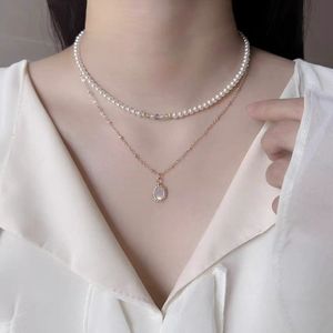 Collier de perles à motifs blancs populaires 2024, pendentif diamant clouté de flocon de neige en argent, design unique et délicatesse élégante - Product Image 1