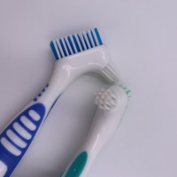 Cepillo de dientes de doble cara de alta calidad para dentaduras excelente herramienta de cuidado bucal