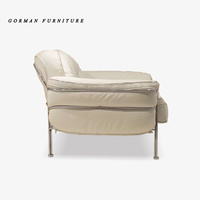 Fauteuil de loisirs Gorman en cuir de style luxueux avec coussin confortable en éponge et structure en acier inoxydable, canapé individuel avec ottoman