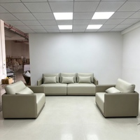 Ensemble de canapés modulaires carrés minimalistes en tissu et cuir color-block de qualité professionnelle pour projets commerciaux de hall d'hôtel