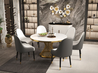 Table à manger ronde moderne de 51 "avec dessus en marbre et piédestal en acier inoxydable doré pour 6 places dans le salon salle à manger hôtel