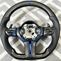 Volant en fibre de carbone pour BMW E71 E87 E90 F10 F15 F20 F30 F32 E92 E53 X4 E82 X6 320i Vente en gros d'usine