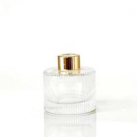 Ensemble de diffuseurs en verre côtelé rond haut de gamme avec bouchons dorés et impression sérigraphiée pour parfums d'intérieur