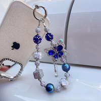 Breloque de téléphone papillon bleu en strass et perles, pendentif de sac artisanal lourd, cordon de poignet, cadeau bijoux pour femme