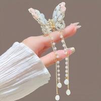 Pince à cheveux papillon élégante avec pompon Pince à cheveux en perles métalliques tendance Pince à cheveux pour filles Accessoires pour cheveux