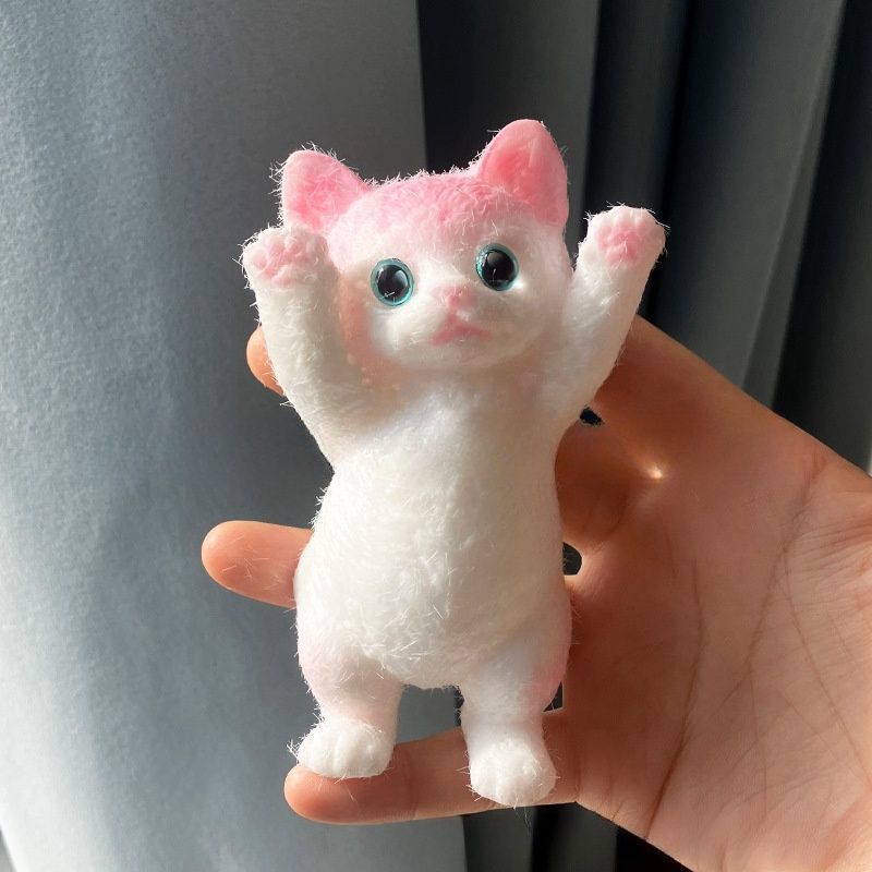 Pink and rosy-cat with paw raised