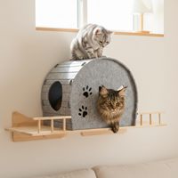 Nichoir mural pour chat en feutre de laine gris, amovible, durable et écologique, en forme d'arche, avec découpes en forme d'empreintes de pattes et double entrée