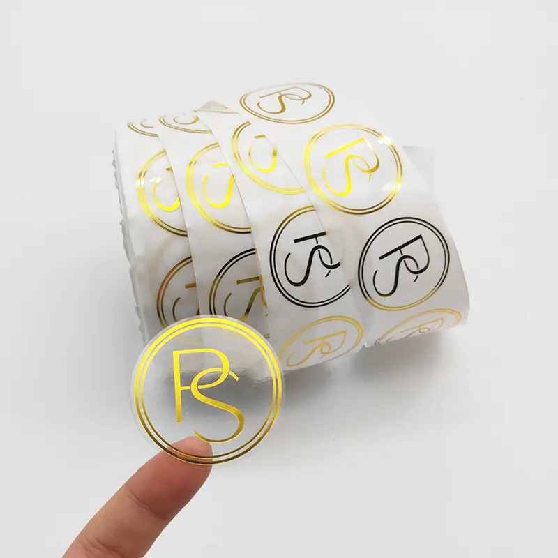 Custom roll logo printing adhesive waterproof gold foil clear vinyl logo label transparent stickers for packaging