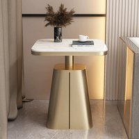 Table basse compacte de luxe léger avec plateau en pierre et structure en fer, design moderne et créatif pour salon