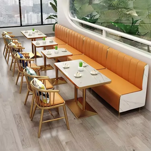 ชุดเฟอร์นิเจอร์คาเฟ่ โต๊ะขาสีทองหน้าท็อปหินอ่อน พร้อมเก้าอี้พนักพิงสาน และที่นั่งยาวหุ้มหนัง PU สีส้มตกแต่งขอบโลหะสีทอง - Product Image 1