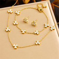Ensemble de bijoux collier et boucles d'oreilles tendance XIXI ensemble de bijoux en acier inoxydable plaqué or 18 carats avec fleur pour cadeaux