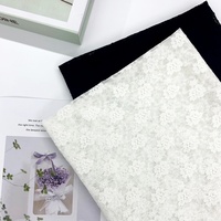 Nouveauté Tissu de tulle en dentelle extensible léger avec jacquard trèfle tissé pour vêtements et textiles d'intérieur