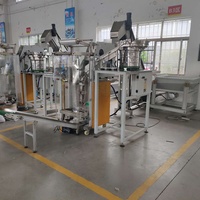 Machine automatique de pesage, de comptage et d'emballage de matériel