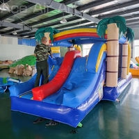 Parcours d'obstacles gonflable commercial tropical palmier avec toboggan et aire de jeux pour enfants, idéal pour la location événementielle