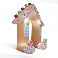 Arche gonflable en forme de maison de pain d'épices de Noël avec des bâtons de sucre et des sucettes pour la décoration d'entrée d'événements festifs