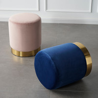 Pouf rond moderne en velours avec anneau métallique