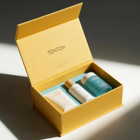Boîte magnétique personnalisée et boîte cadeau blanc ivoire pour ensemble de soins de la peau et emballage de luxe avec impression dorée mate