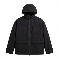 Blouson bomber imperméable à capuche noir personnalisé unisexe coupe-vent zippé avec poches et doublure en polyester pour une utilisation en extérieur en hiver