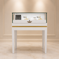 Vitrine à bijoux autoportante blanche haute brillance avec finition dorée, verre trempé et éclairage LED 360° °   Tiroir coulissant de luxe