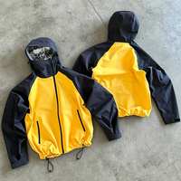 Veste coupe-vent légère personnalisée pour homme, fabriquée par YSJY OEM, en nylon camouflage, coupe boxy, fermeture éclair, imperméable.