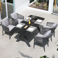 Ensemble table et chaises d'extérieur en aluminium au design nordique, résistant à l'eau et aux UV, chaises longues en rotin pour patios, villas, hôtels