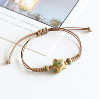 Bracelet de couple en céramique colorée en forme d'étoile de mer, bracelet en corde tressée de couleur café, perles en céramique, cadeau pour homme et femme