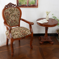 Chaise de salle à manger européenne vintage en bois massif sculpté avec revêtement en tissu floral