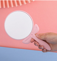 Miroir de maquillage à poignée circulaire avec nœud papillon, miroir de beauté portable, miroir de maquillage créatif avec impression de logo, vente en gros
