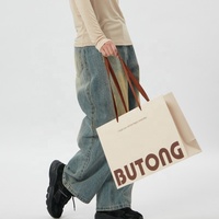 Sac cadeau en papier couché de luxe écologique de haute qualité, design découpé à la main, logo personnalisé, lamination numérique, papier épais sans couture
