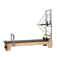 Reformer Pilates à cadre en chêne durable avec demi-tournebrise, système d'appui-tête réglable, accessoires professionnels pour studio de yoga et Pilates