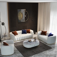 Ensemble de canapés en cuir véritable blanc crème moderne et confortable pour salon, avec décoration en métal doré et coussins
