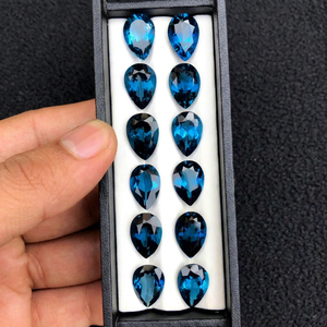พลอยโทแพซสีน้ำเงินลอนดอนทรงลูกแพร์ขนาด 10x14 มม. จากผู้ผลิตโดยตรง BU GEMS พร้อมใบรับรองจากผู้เชี่ยวชาญสำหรับทำเครื่องประดับ จำหน่ายจำนวนมาก - Product Image 1