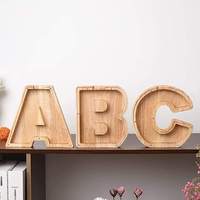 Vente en gros de tirelires personnalisées en bois transparent en forme de lettres, de cochons, de chiens, de chats, ou de tirelires en vrac pour enfants, tirelires cassables